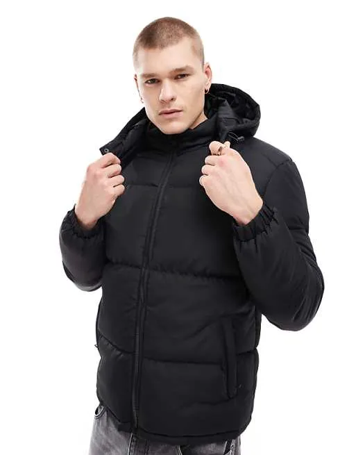 Man wearing a versatile black puffer jacket